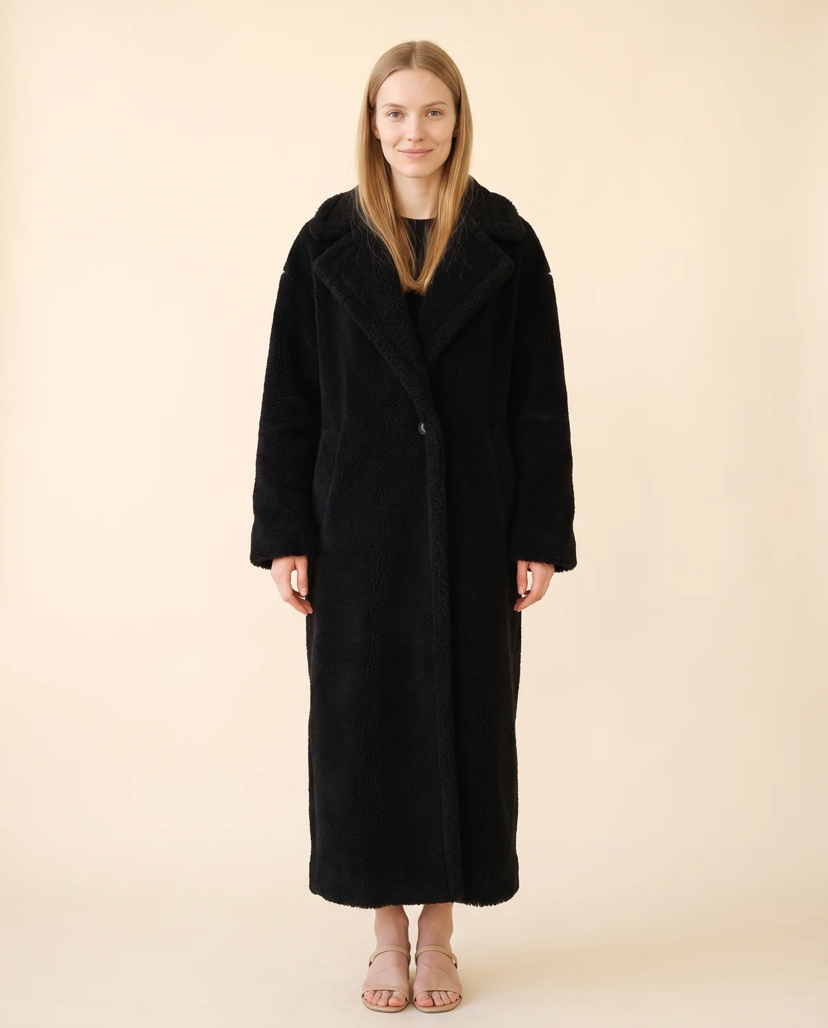 Maxi Teddy Coat in Black, front view, worn by Maya