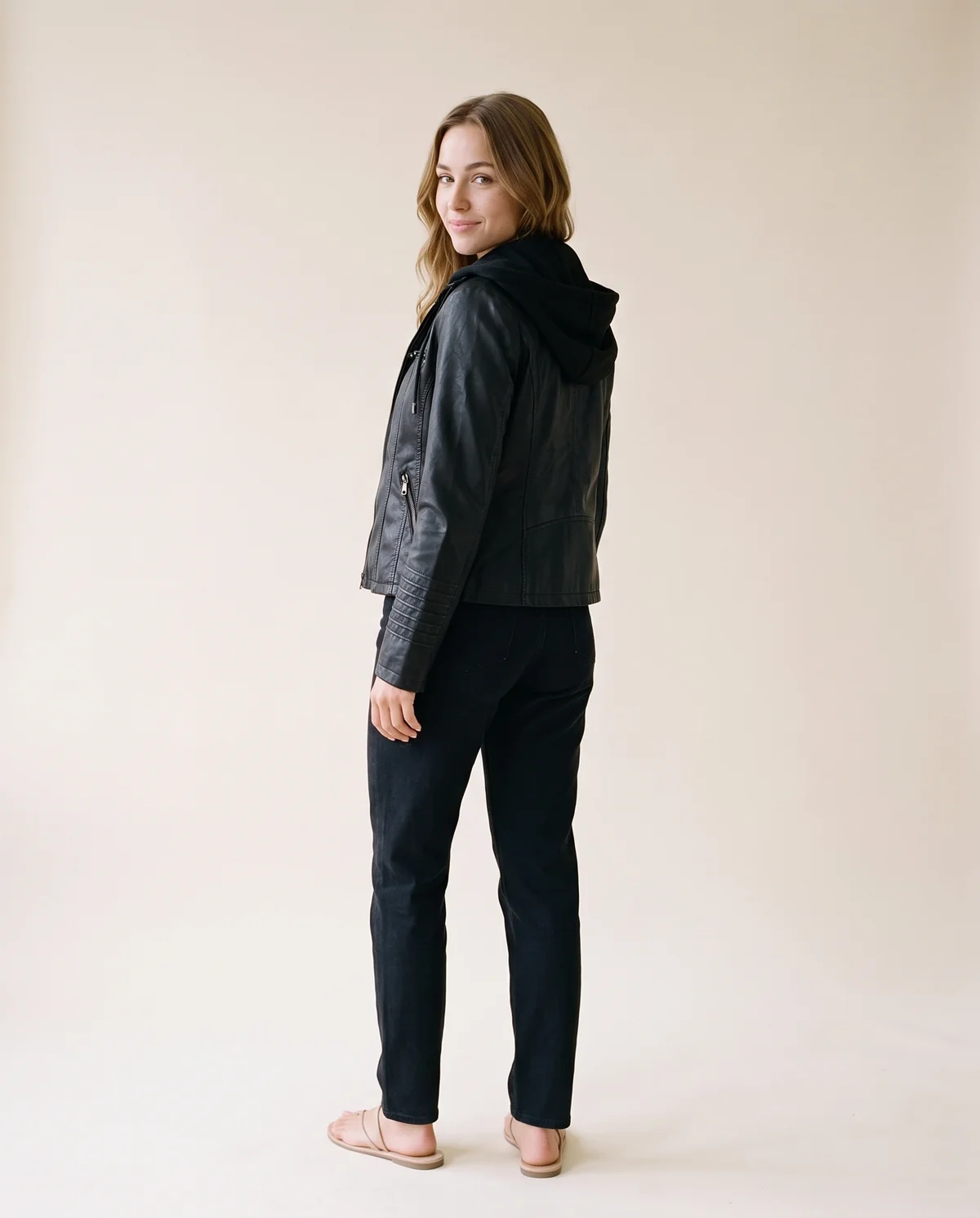 Faux Leather Biker Jacket with Soft Hood in Black, back view, worn by Ava