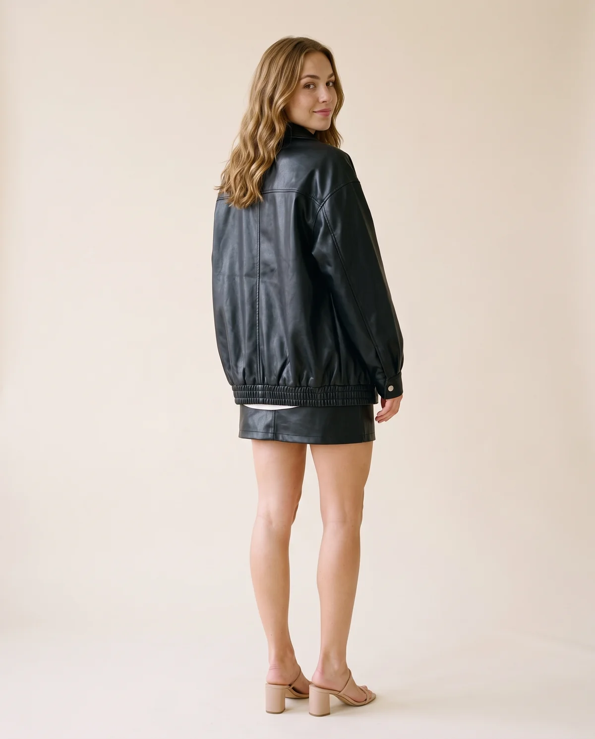 Faux Leather Oversized Snap Shacket in Black, back view, worn by Ava