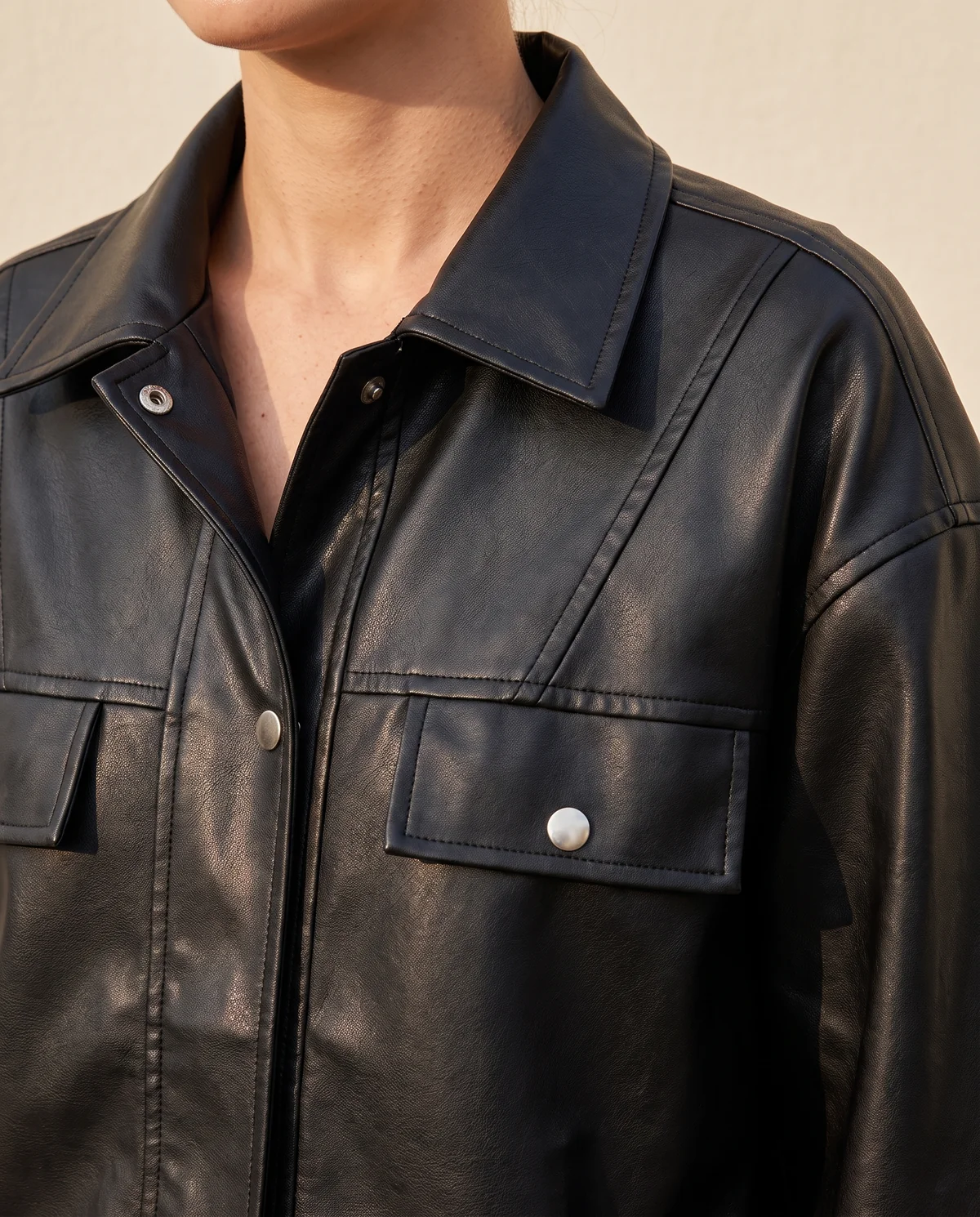 Faux Leather Oversized Snap Shacket in Black, close-up of the detail