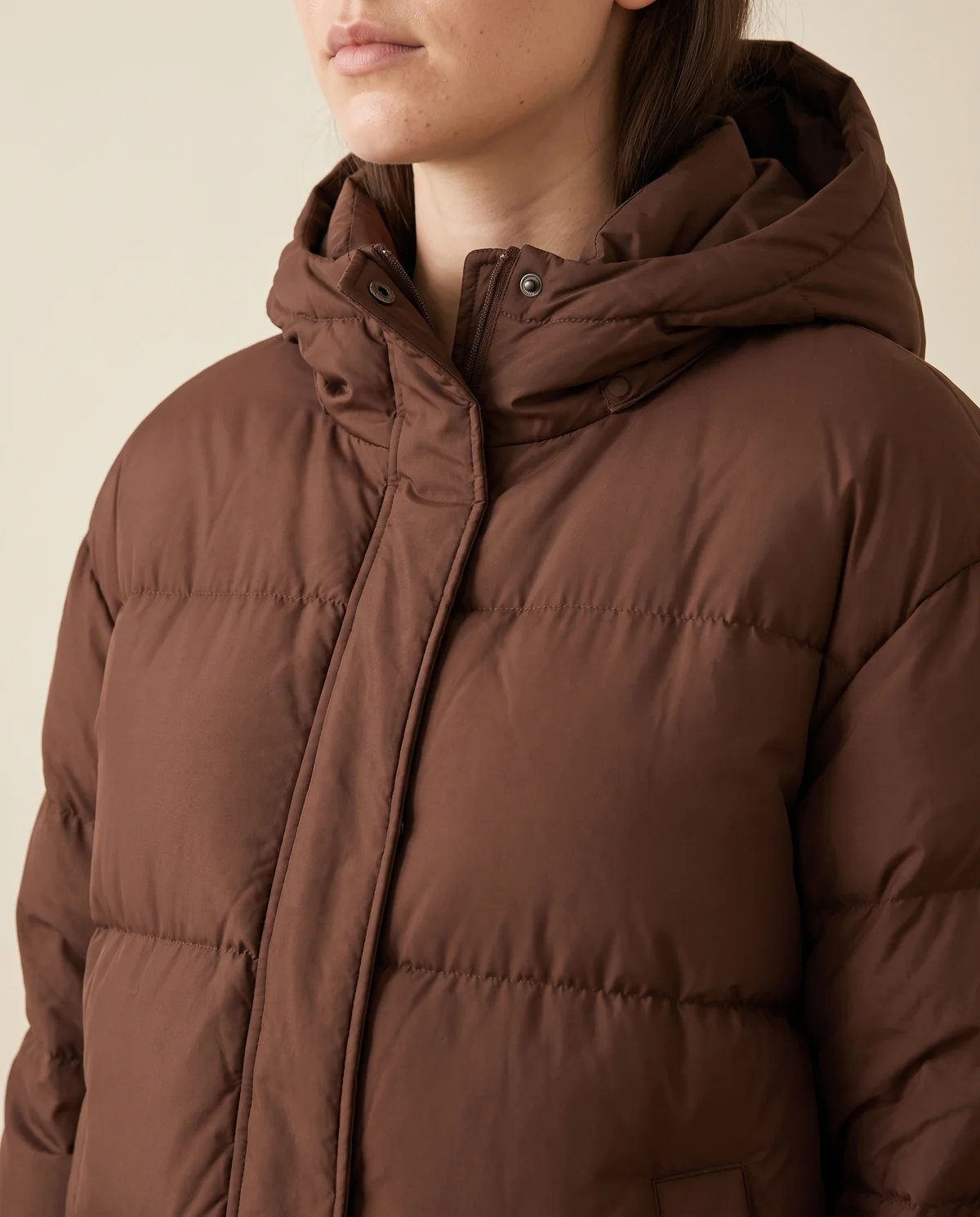 Long Hooded Puffer Coat in Chocolate, close-up of the detail