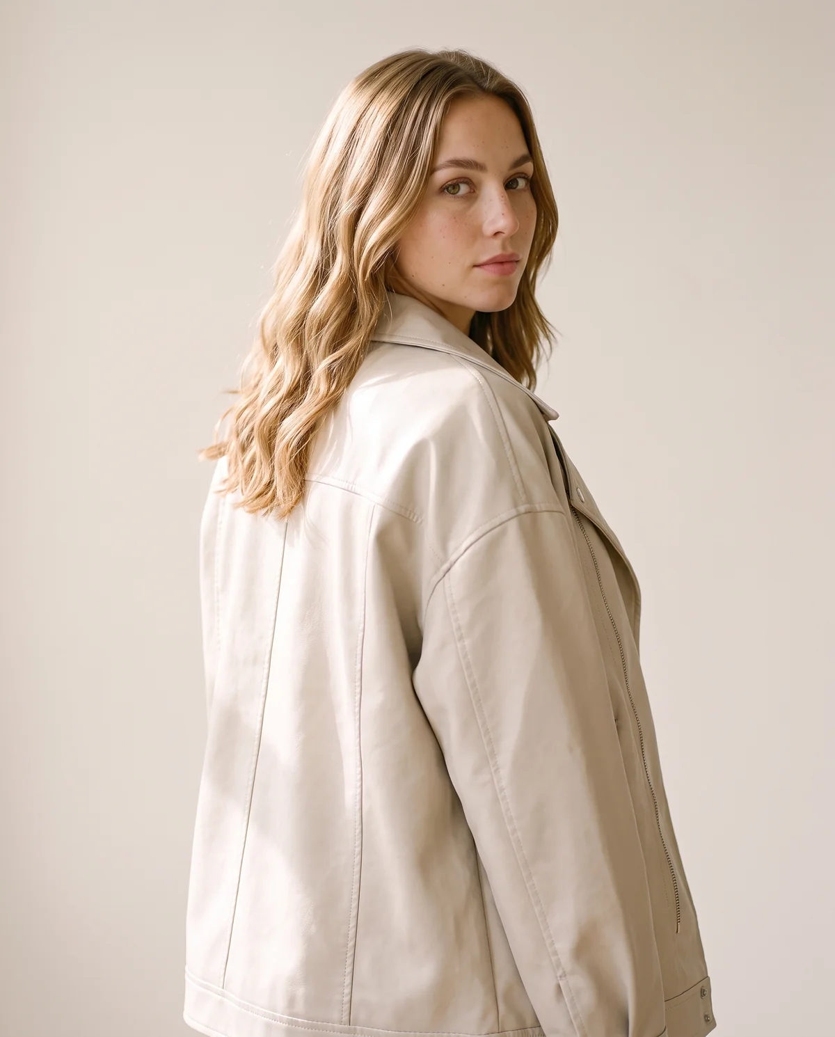 Faux Leather Relaxed Lapel Biker Jacket in Stone, back view, worn by Ava