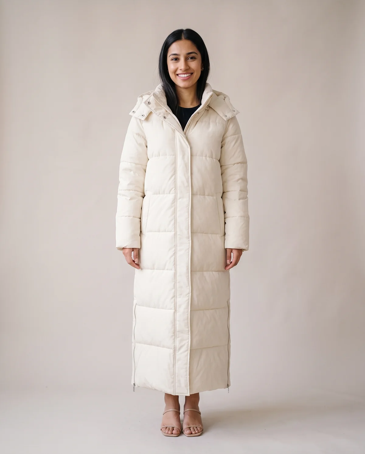 Maxi Puffer Coat with Side Zips in Cream, front view, worn by Priya