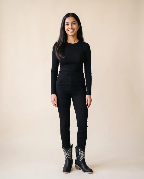 Black Embroidered Western Ankle Boot in Black, front view, worn by Priya