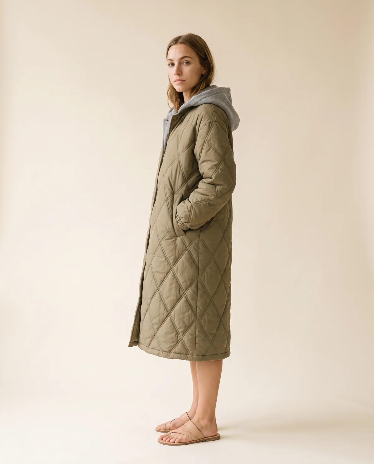 Diamond-Quilted Coat with Jersey Hood in Olive, side view, worn by Ava