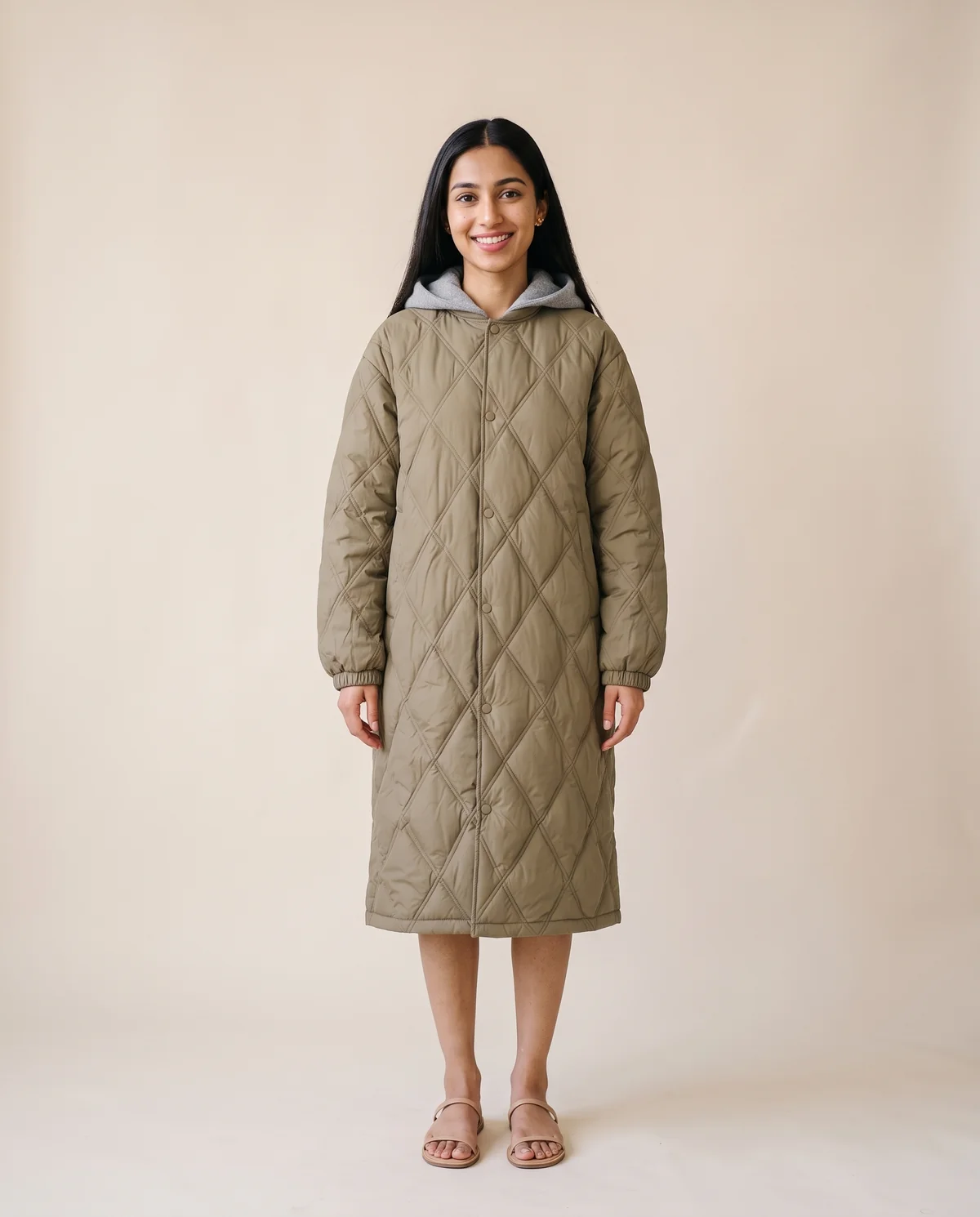 Diamond-Quilted Coat with Jersey Hood in Olive, front view, worn by Priya