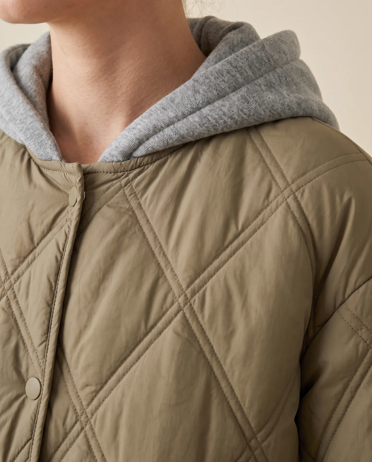 Diamond-Quilted Coat with Jersey Hood in Olive, close-up of the detail