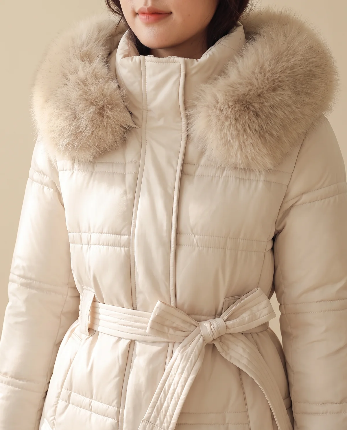 Faux Fur Hood Belted Puffer Coat in Ivory, close-up of the detail