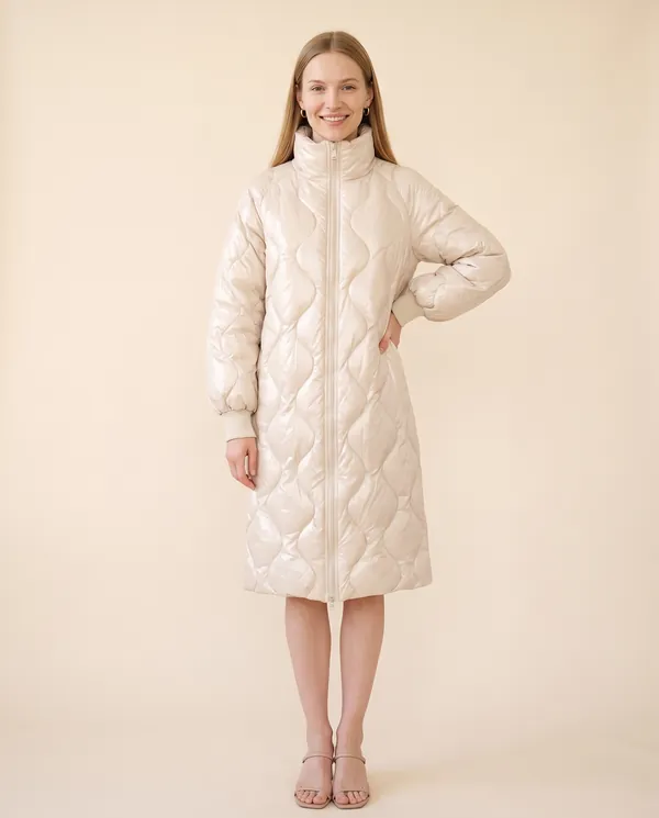 Glossy Quilted Puffer Coat in Cream, front view, worn by Maya