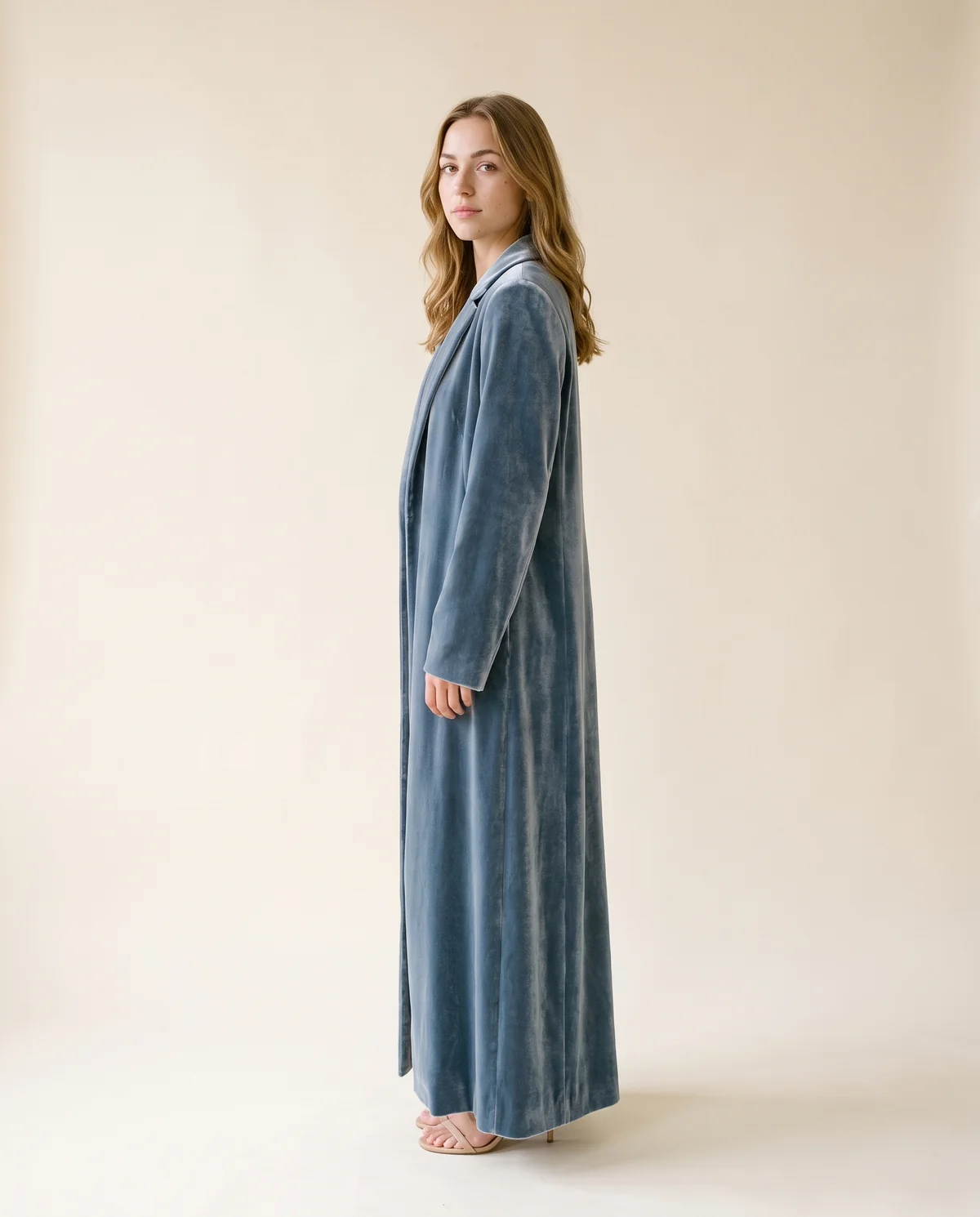 Long Velvet Coat in Slate Blue, side view, worn by Ava
