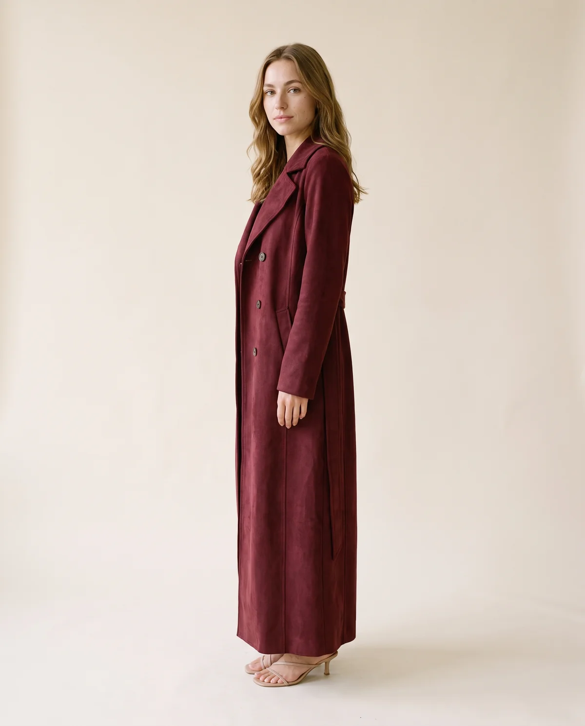 Long Faux Suede Coat in Burgundy, side view, worn by Ava