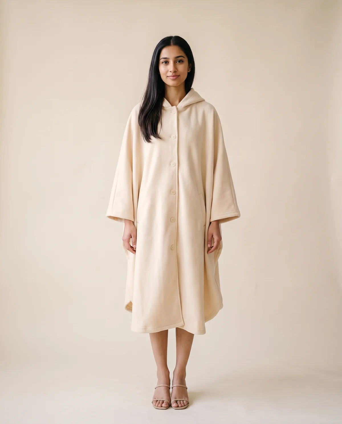 Hooded Cape Coat in Cream, front view, worn by Priya