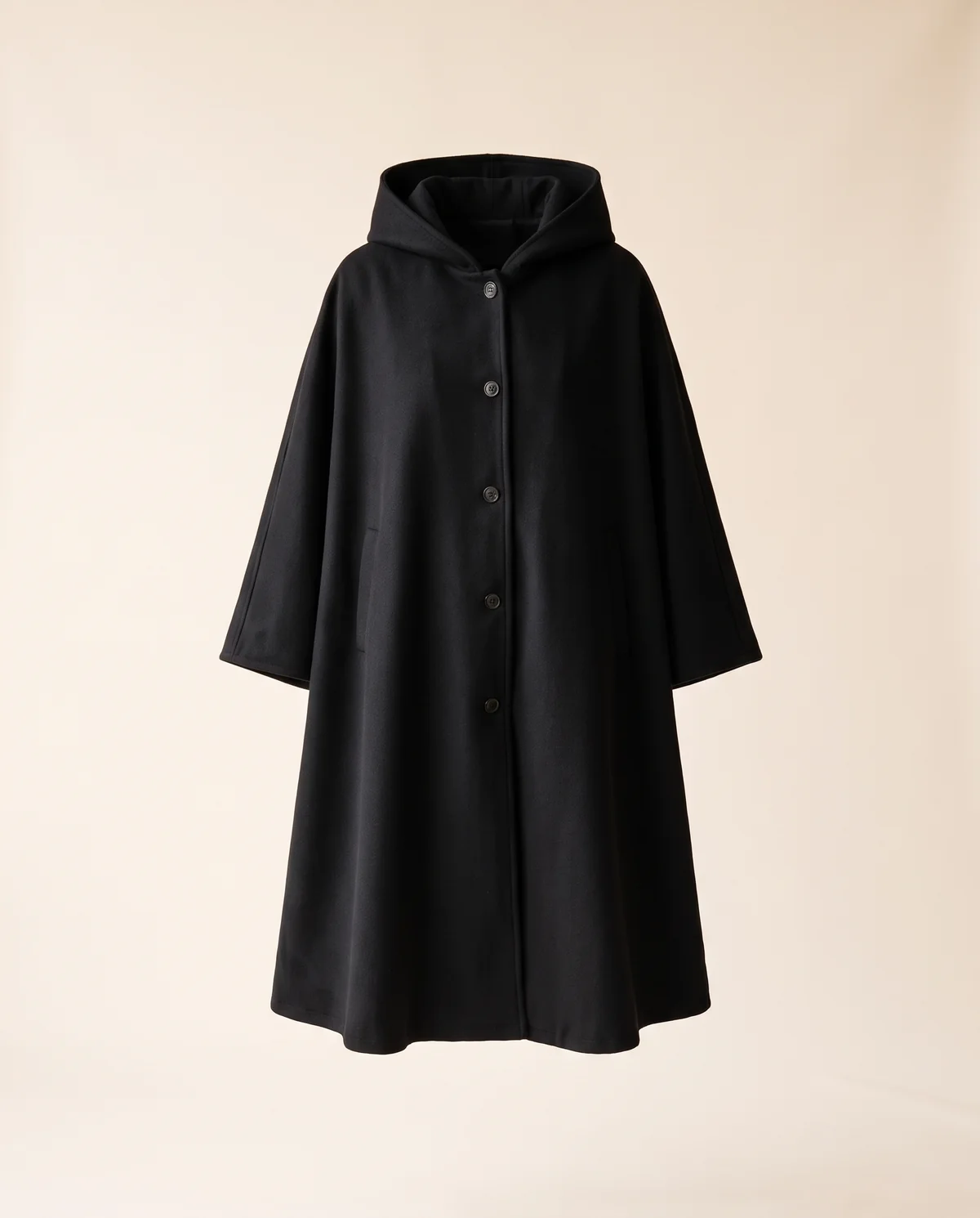 Hooded Cape Coat in Black, product shot on a plain background