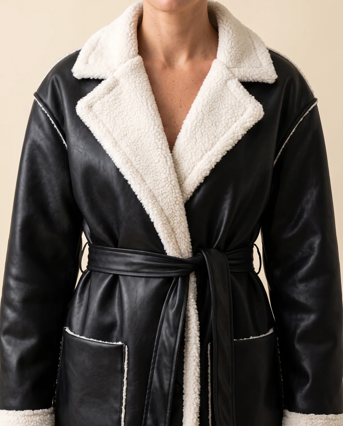 Belted Long Faux Leather Coat in Black, close-up of the detail