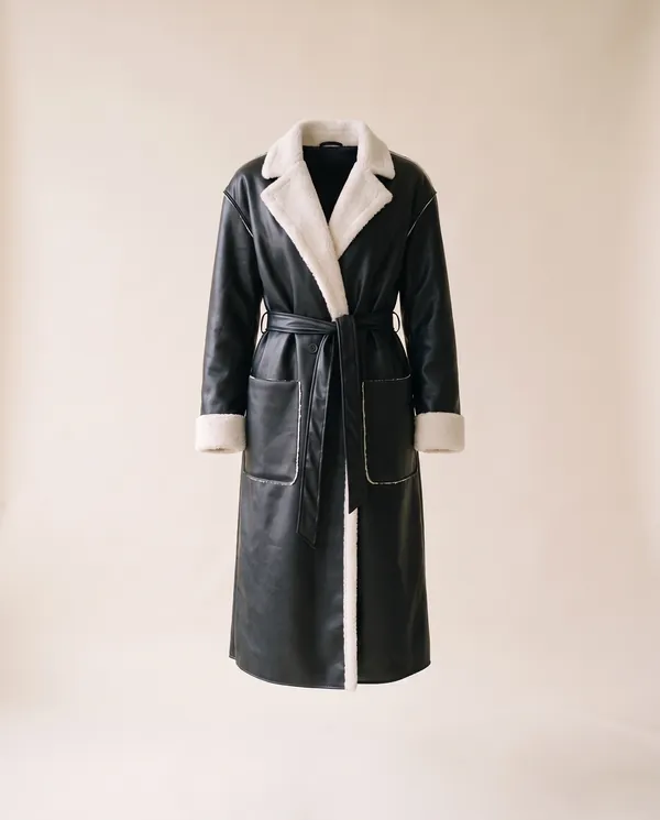 Belted Long Faux Leather Coat in Black, product shot on a plain background