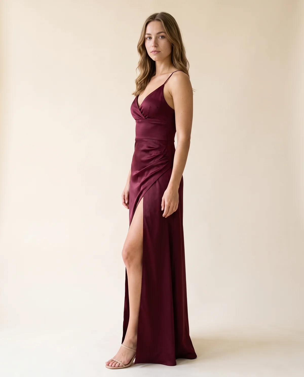 Stretch Satin Wrap Maxi Dress in Wine, side view, worn by Ava