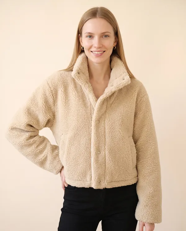 Faux Teddy Cropped Stand-Collar Jacket in Cream, front view, worn by Maya