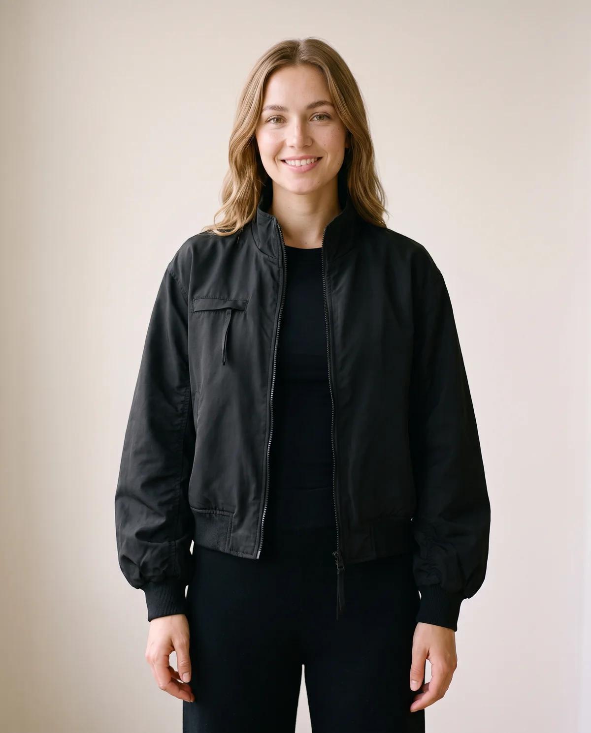 Stand-Collar Zip Bomber Jacket in Black, front view, worn by Ava