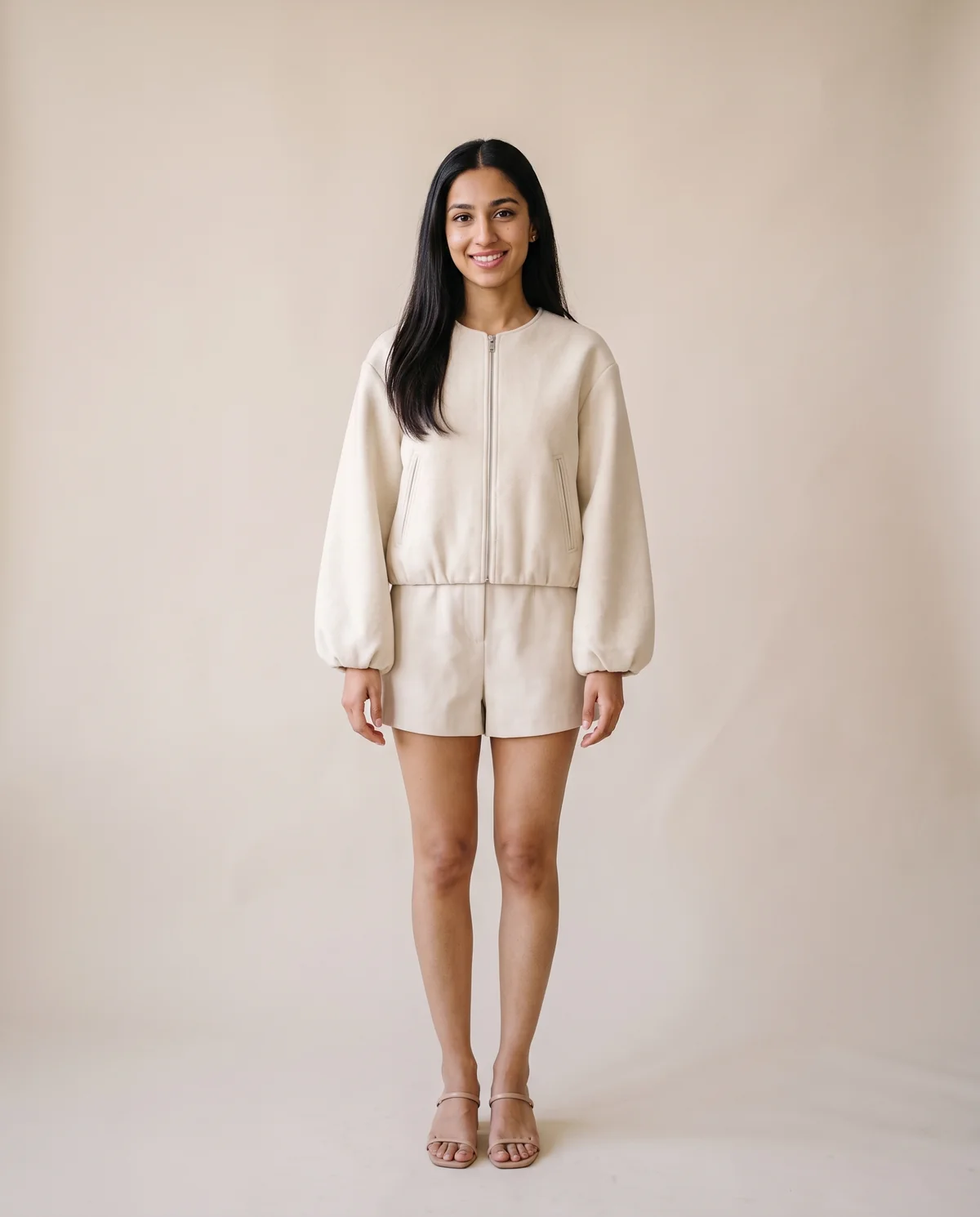 Soft Round-Neck Balloon-Sleeve Bomber in Cream, front view, worn by Priya