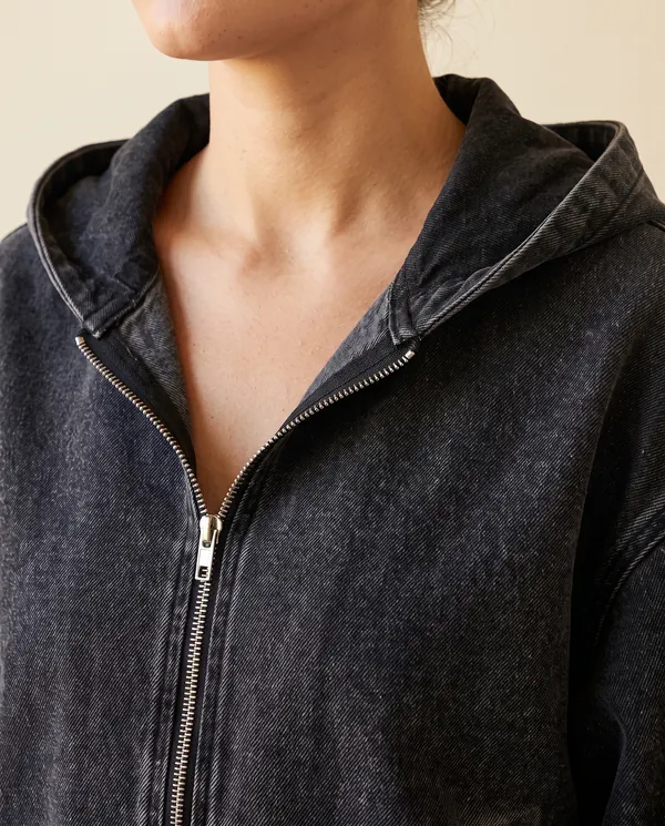 Washed Denim Hooded Zip Bomber in Washed Black, close-up of the detail