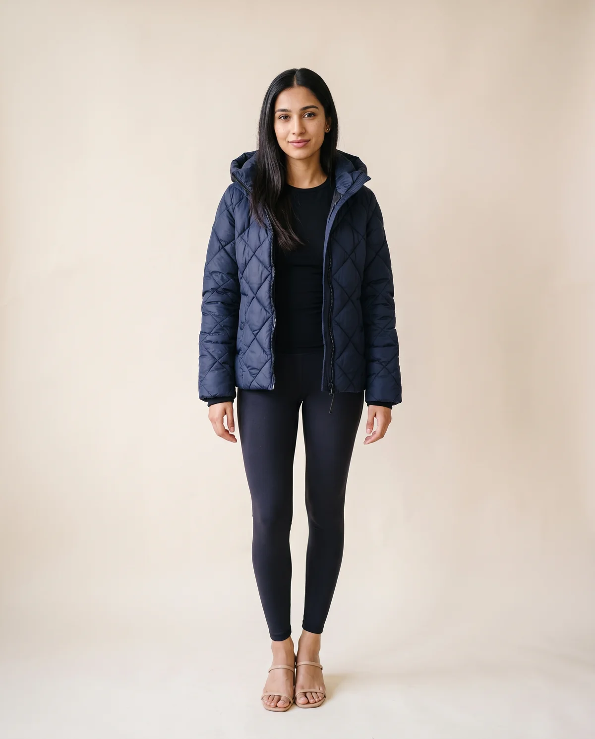 Diamond-Quilted Hooded Jacket in Navy, front view, worn by Priya