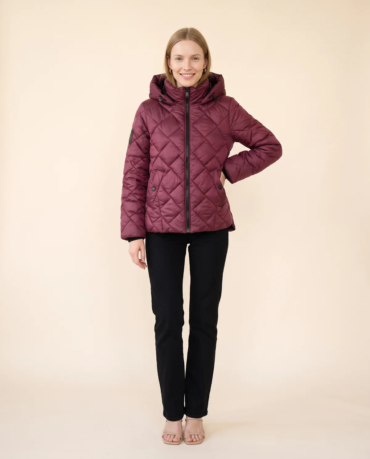 Diamond-Quilted Hooded Jacket in Burgundy, front view, worn by Maya