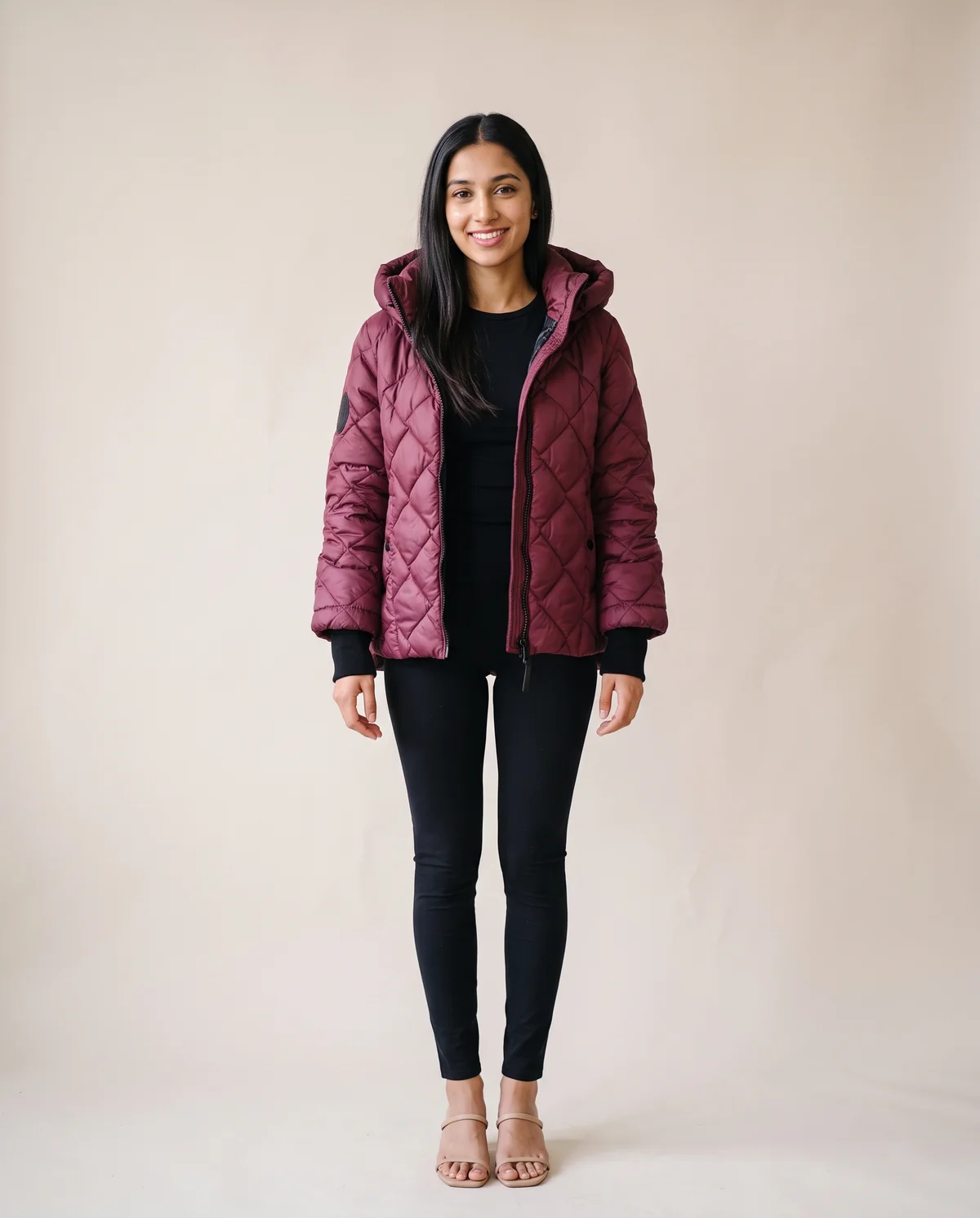 Diamond-Quilted Hooded Jacket in Burgundy, front view, worn by Priya