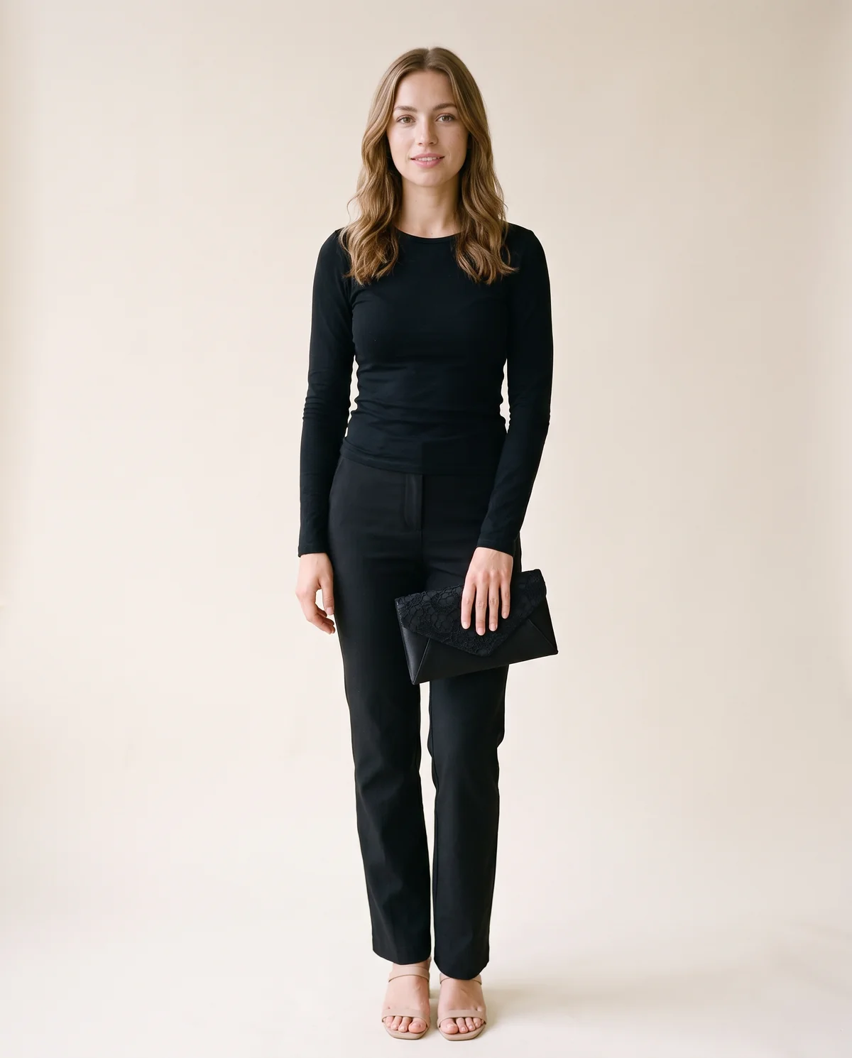 Lace Satin Envelope Clutch in Black, front view, worn by Ava