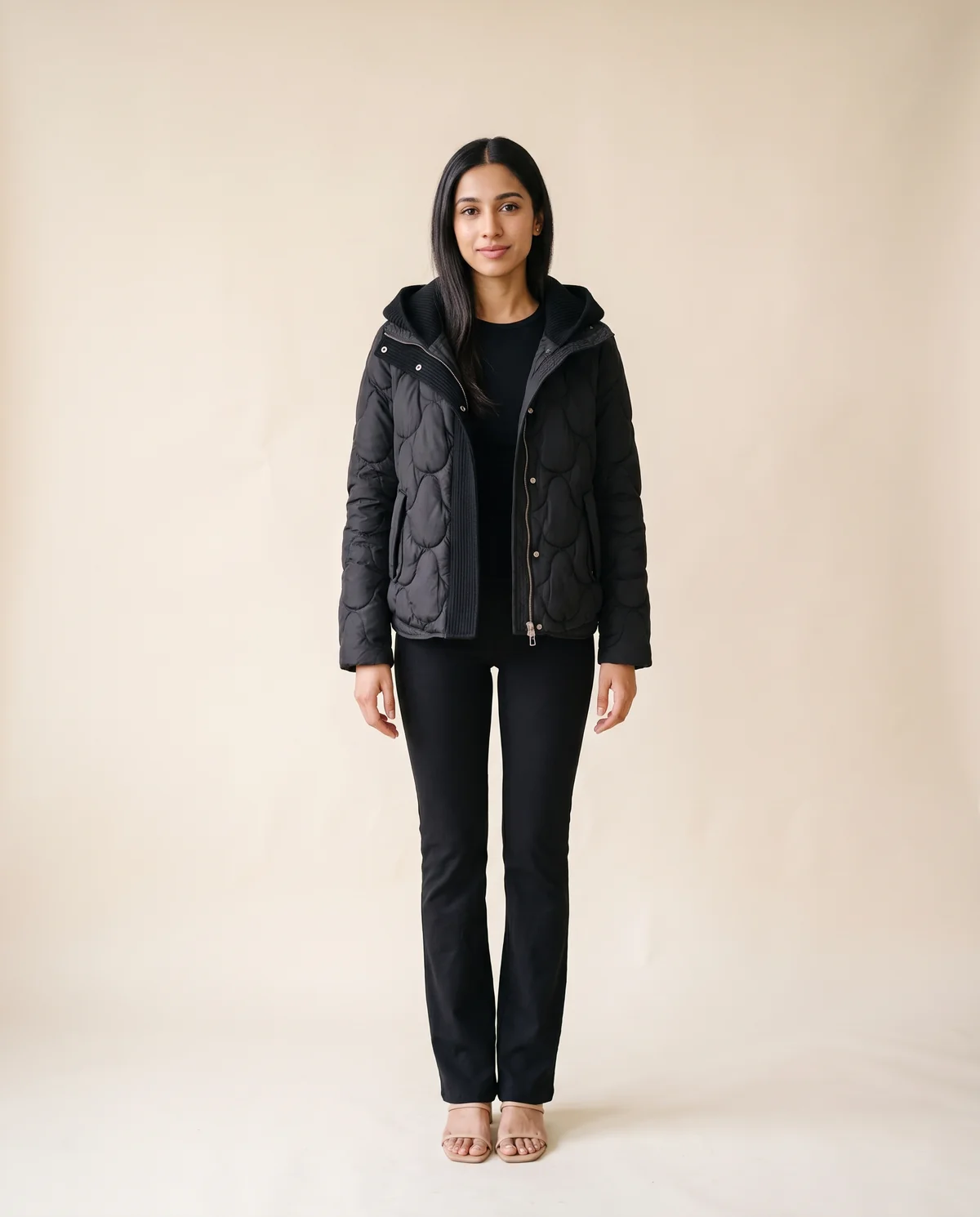 Quilted Puffer Jacket with Knit Hood in Black, front view, worn by Priya