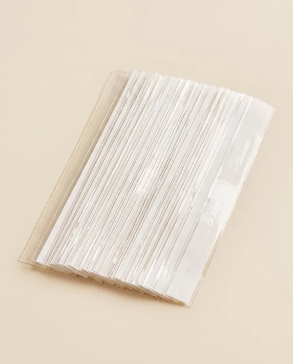 Double-Sided Dress Tape Set in Clear, product shot on a plain background