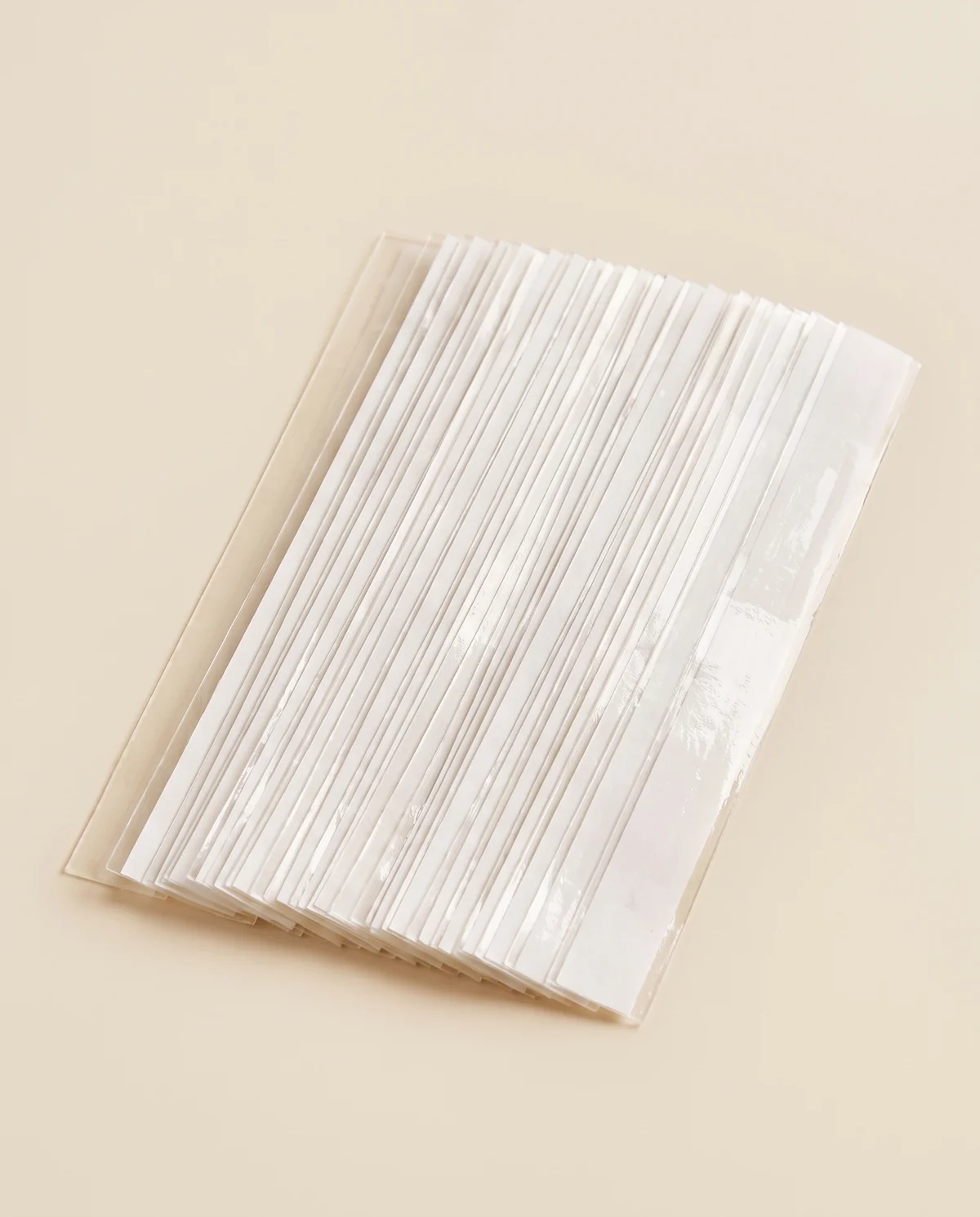 Double-Sided Dress Tape Set in Clear, product shot on a plain background