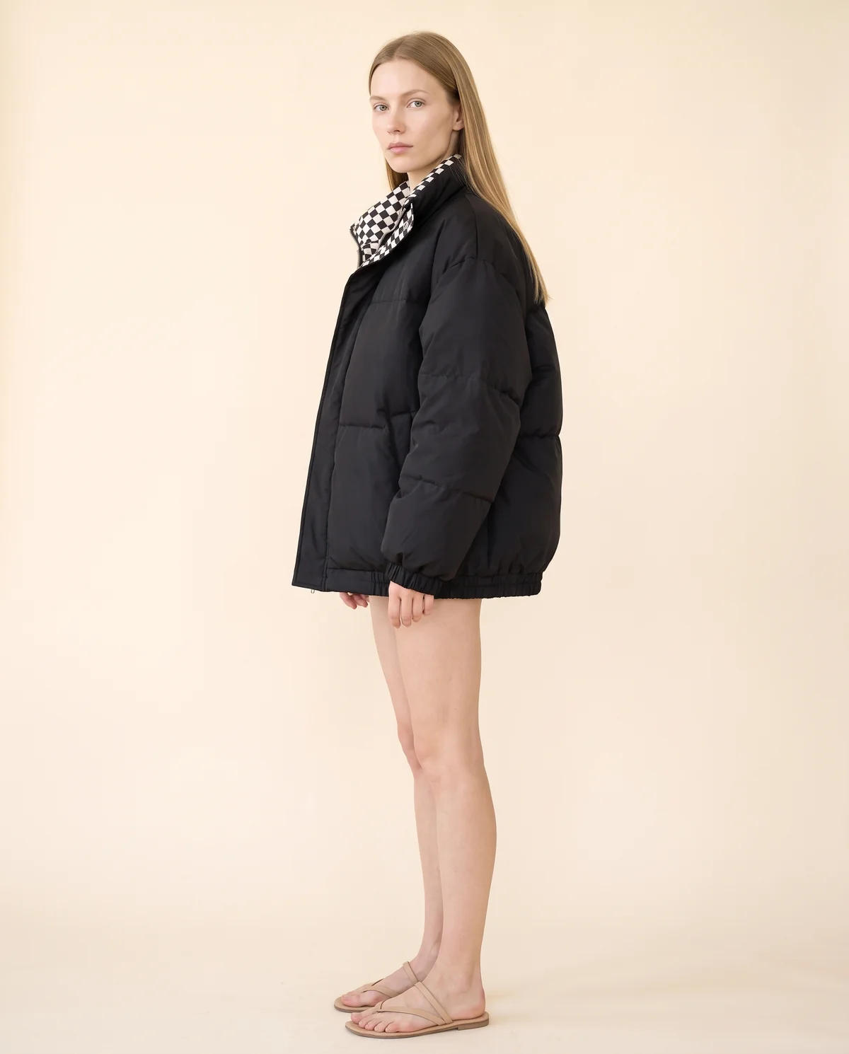 Oversized Puffer Jacket with Check Collar in Black, side view, worn by Maya