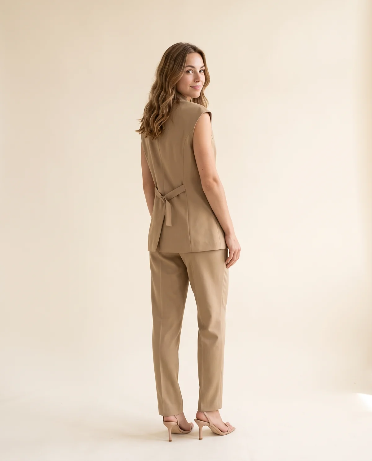 Double-Breasted Waistcoat and Trouser Set in Camel, back view, worn by Ava