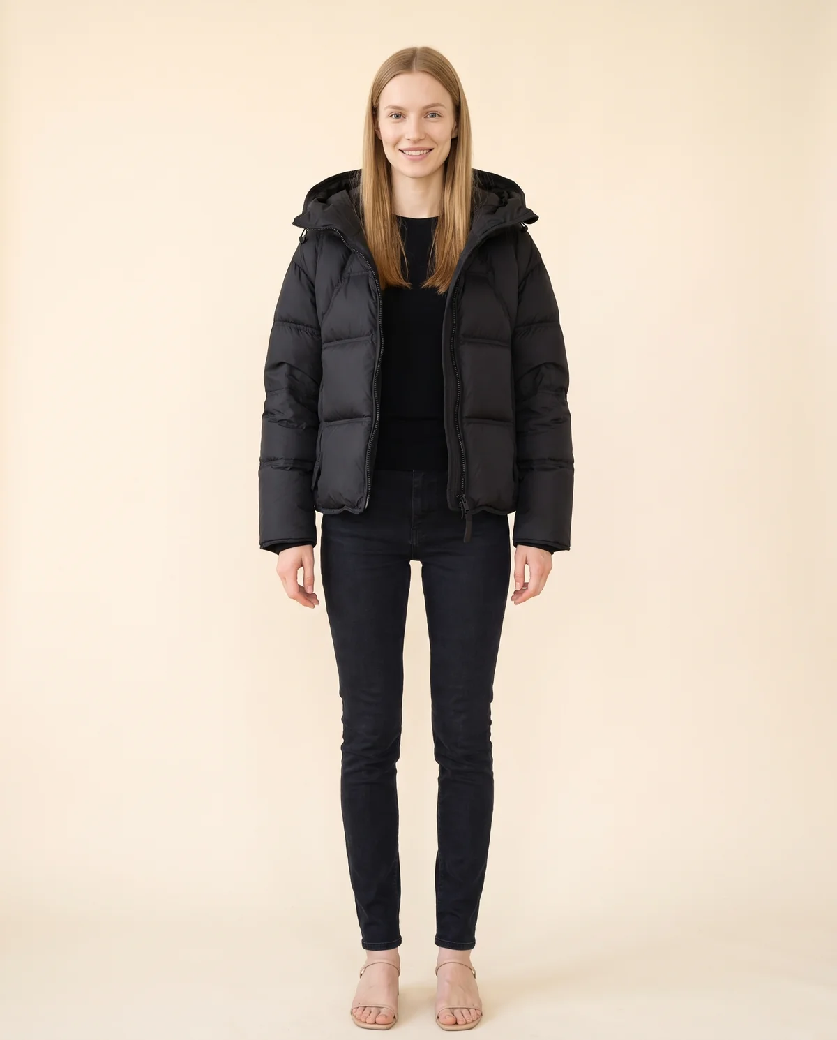 Short Hooded Puffer Jacket in Black, front view, worn by Maya