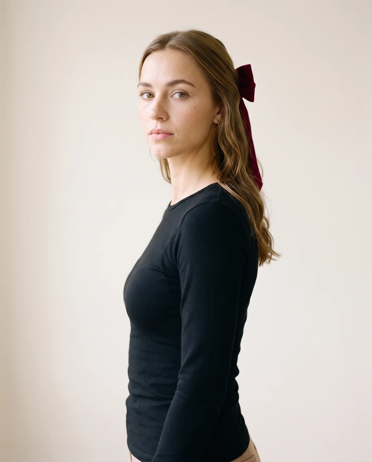 Velvet Bow Hair Barrette in Burgundy, side view, worn by Ava