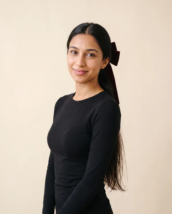 Velvet Bow Hair Barrette in Burgundy, front view, worn by Priya