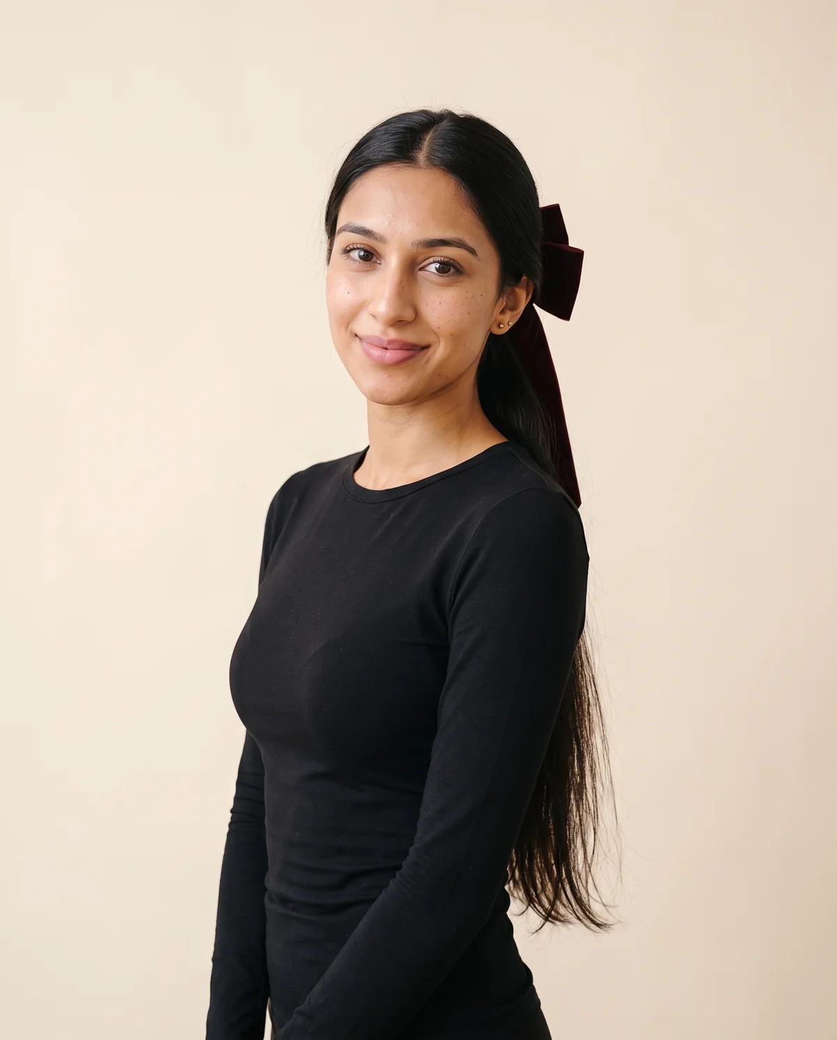 Velvet Bow Hair Barrette in Burgundy, front view, worn by Priya