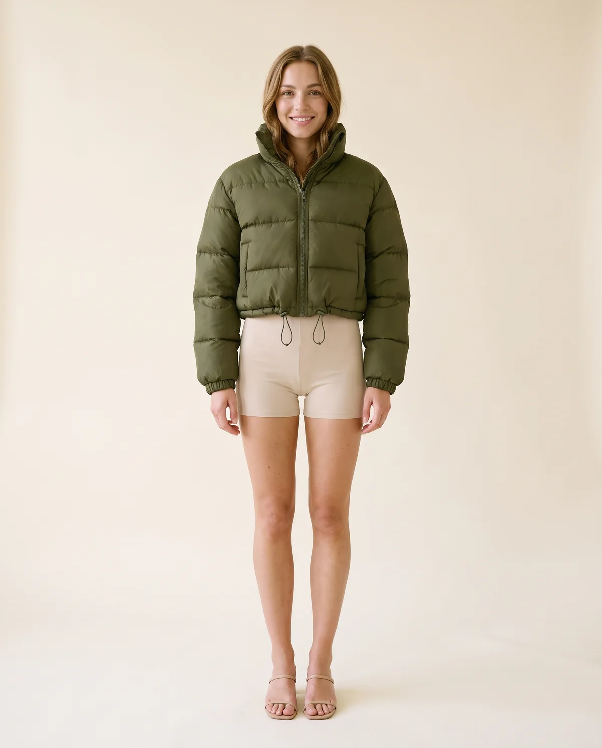 Cropped Puffer Jacket with Drawcord Hem in Olive, front view, worn by Ava