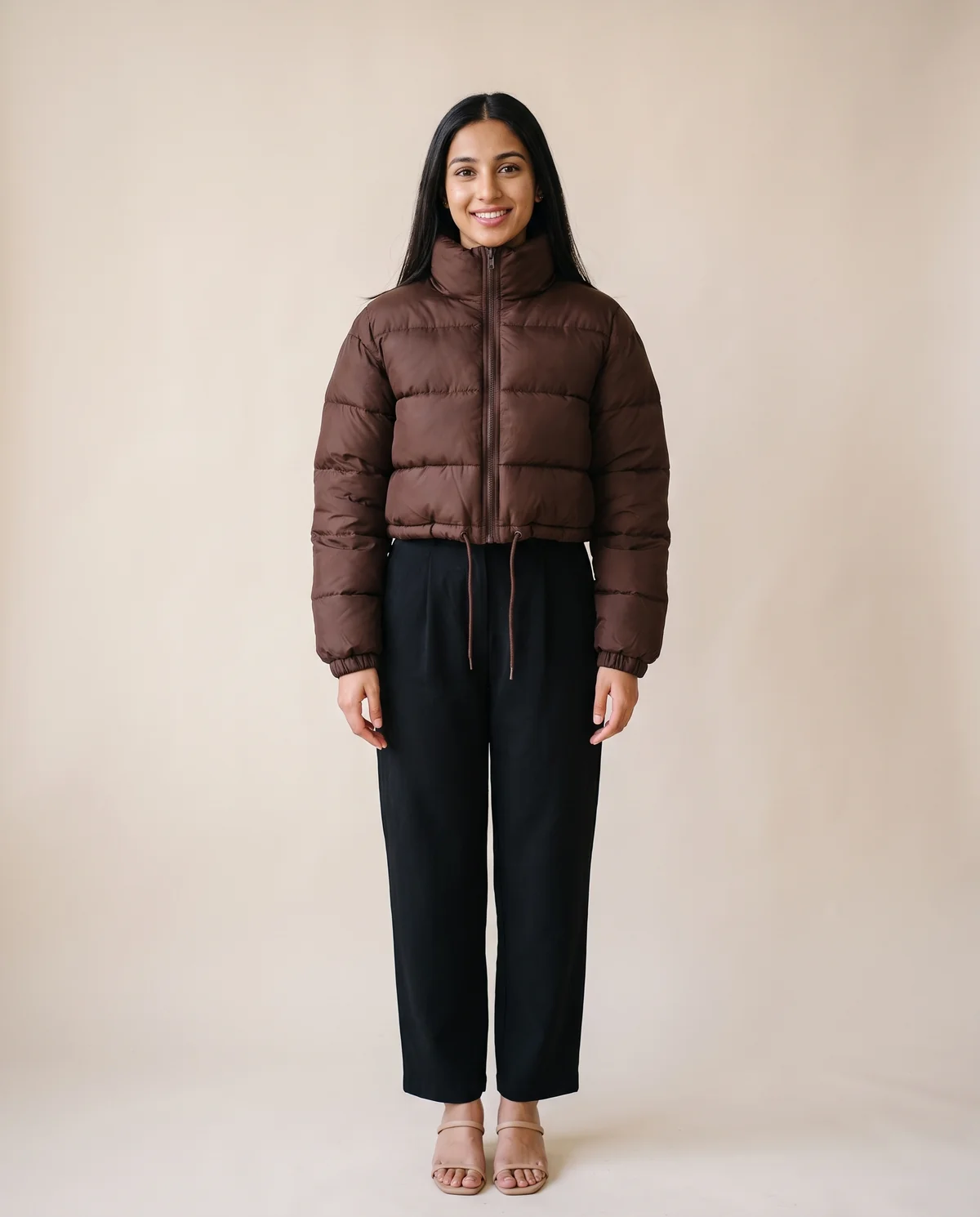 Cropped Puffer Jacket with Drawcord Hem in Chocolate, front view, worn by Priya