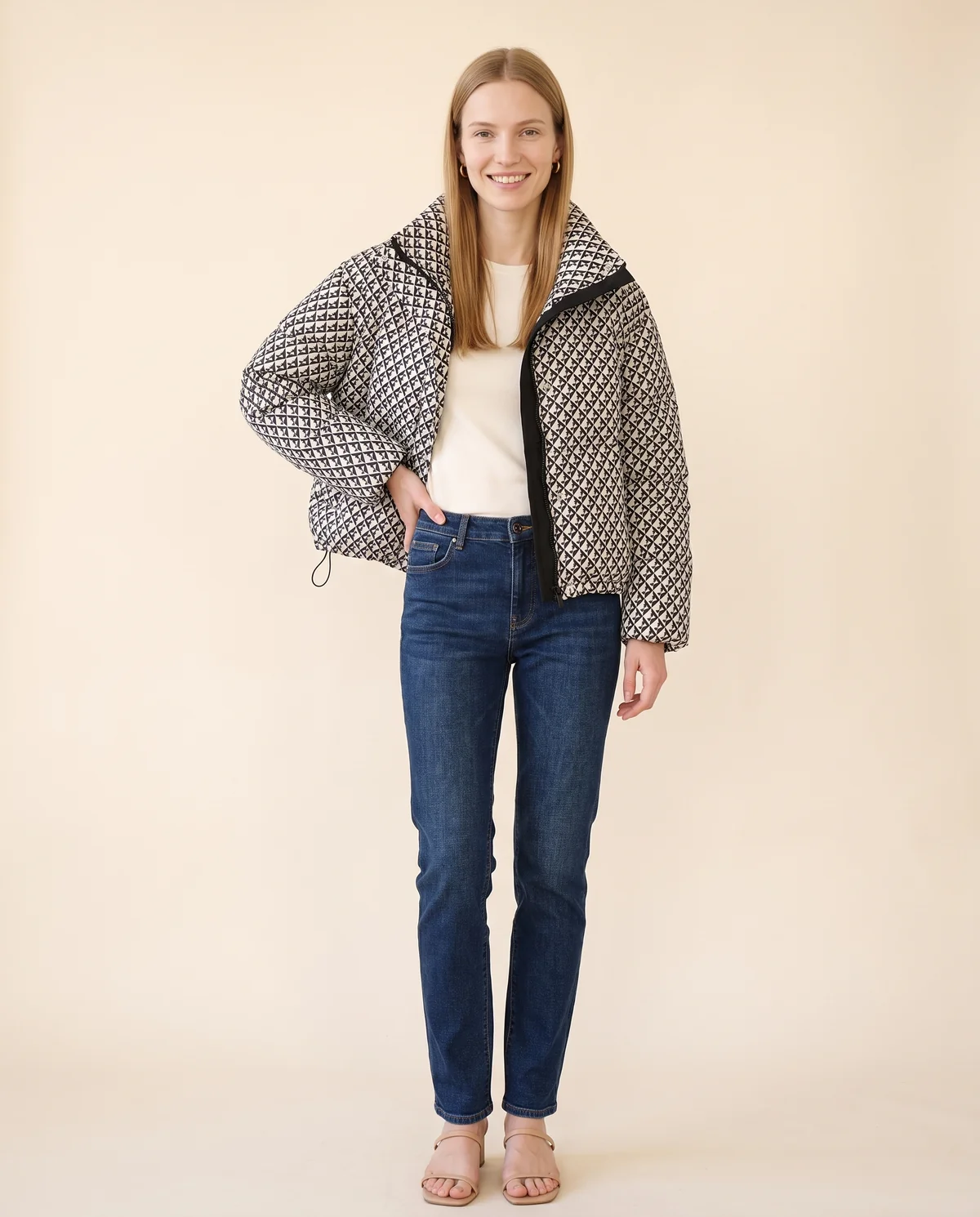 Geometric-Print Puffer Jacket in Black, front view, worn by Maya