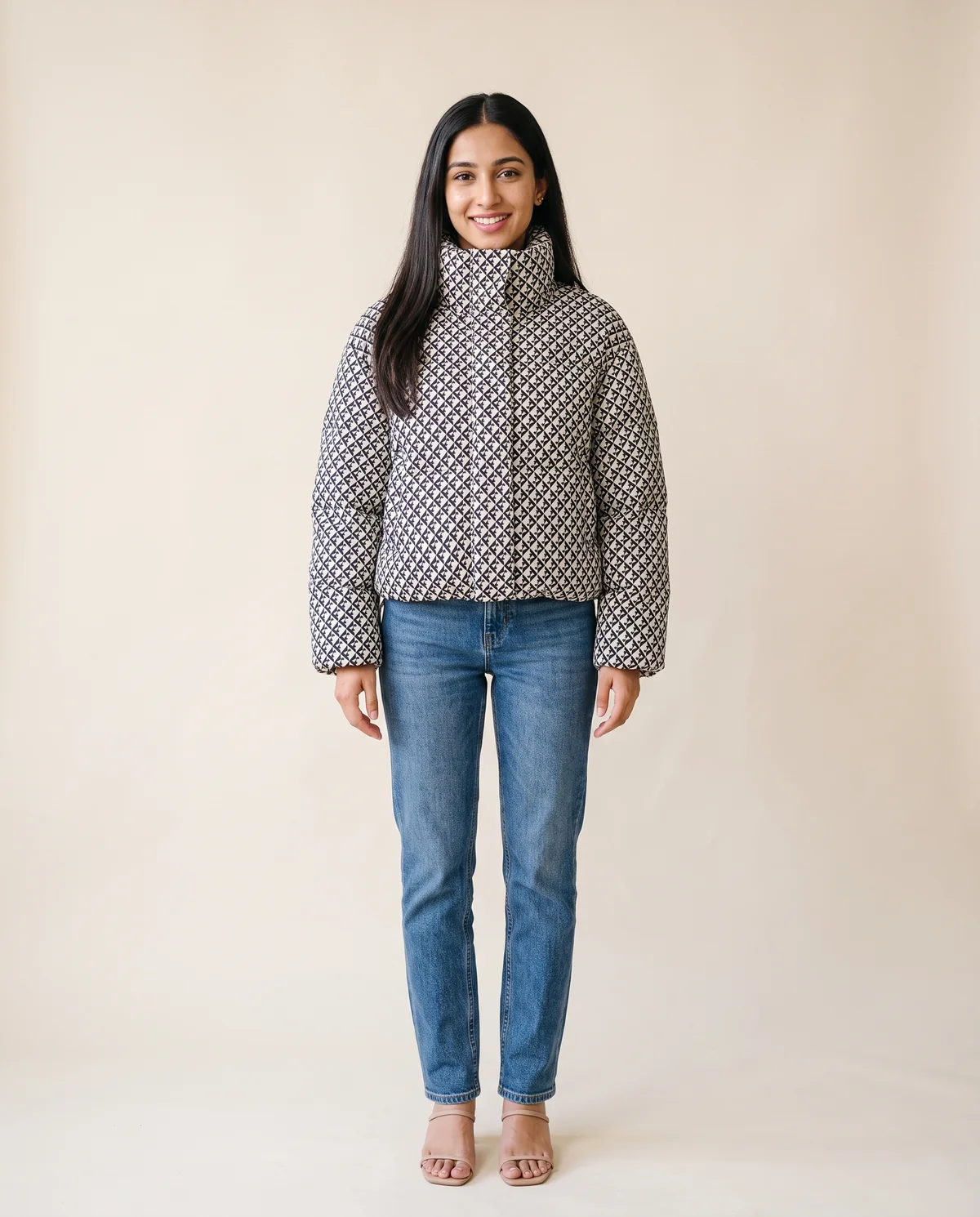 Geometric-Print Puffer Jacket in Black, front view, worn by Priya