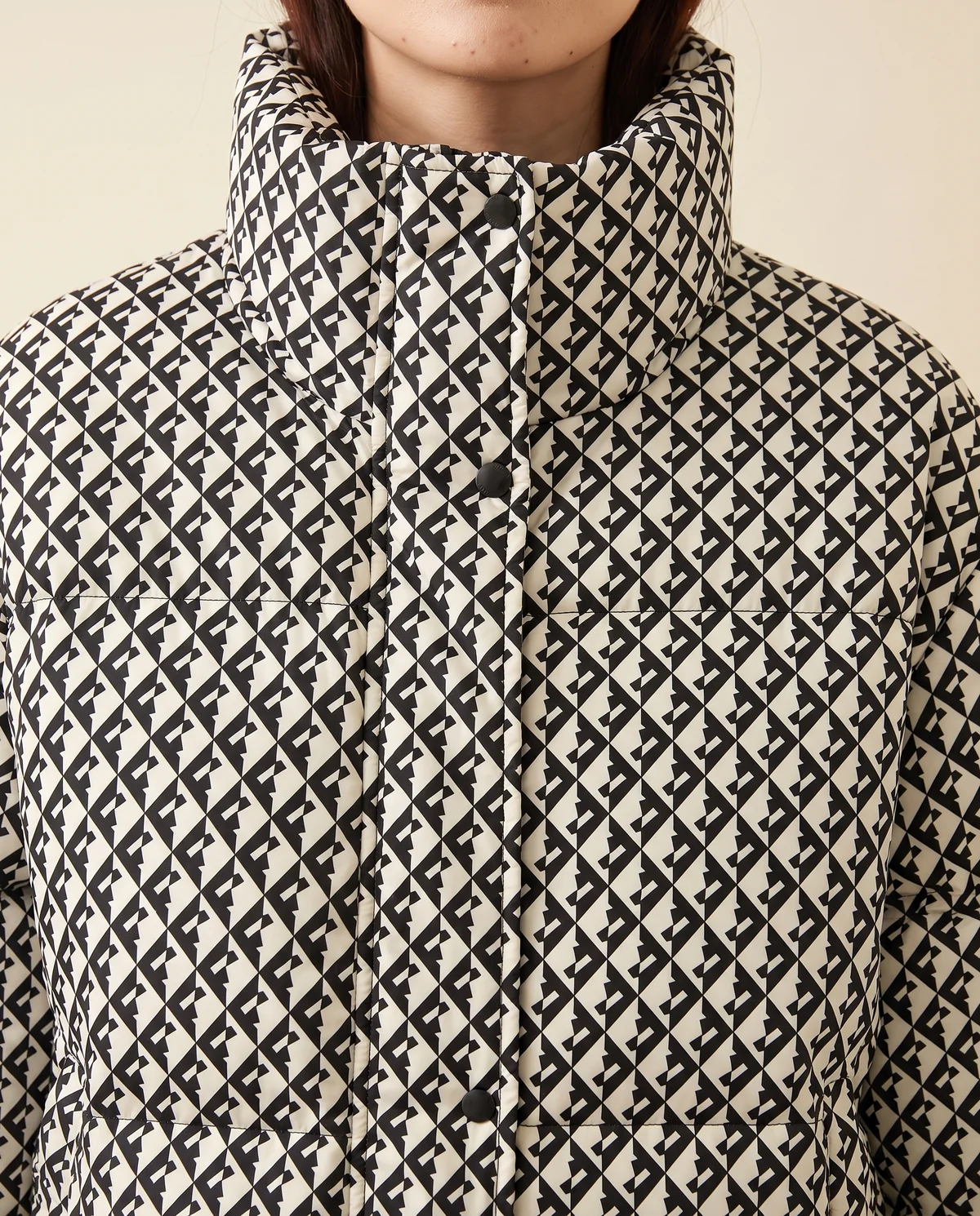 Geometric-Print Puffer Jacket in Black, close-up of the detail