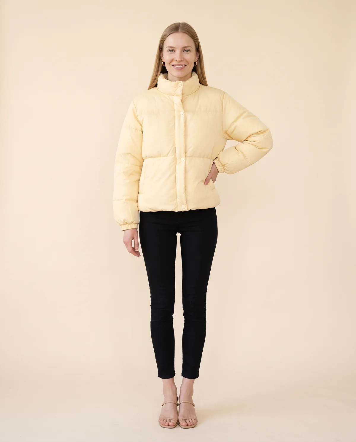 Short Stand-Collar Puffer with Snap Front in Yellow, front view, worn by Maya