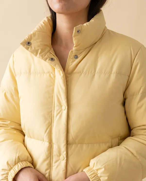 Short Stand-Collar Puffer with Snap Front in Yellow, close-up of the detail