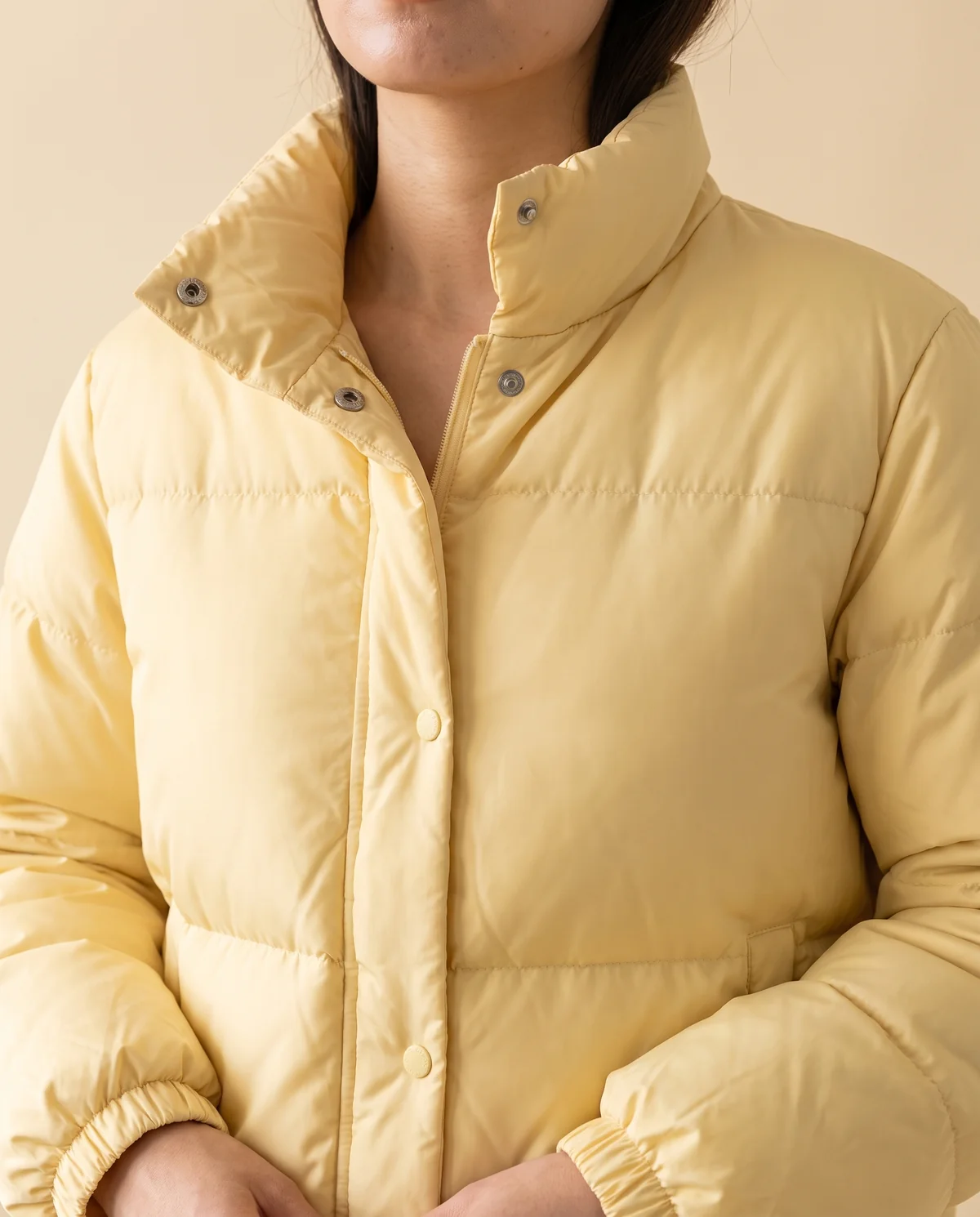 Short Stand-Collar Puffer with Snap Front in Yellow, close-up of the detail