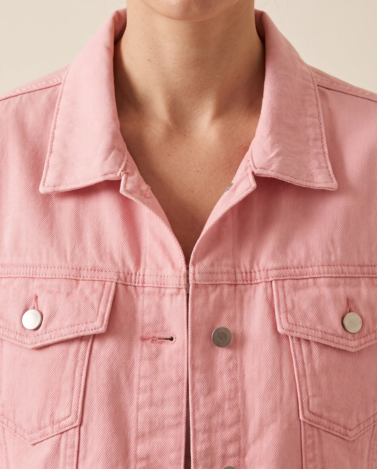 Cropped Denim Trucker Jacket in Pink, close-up of the detail