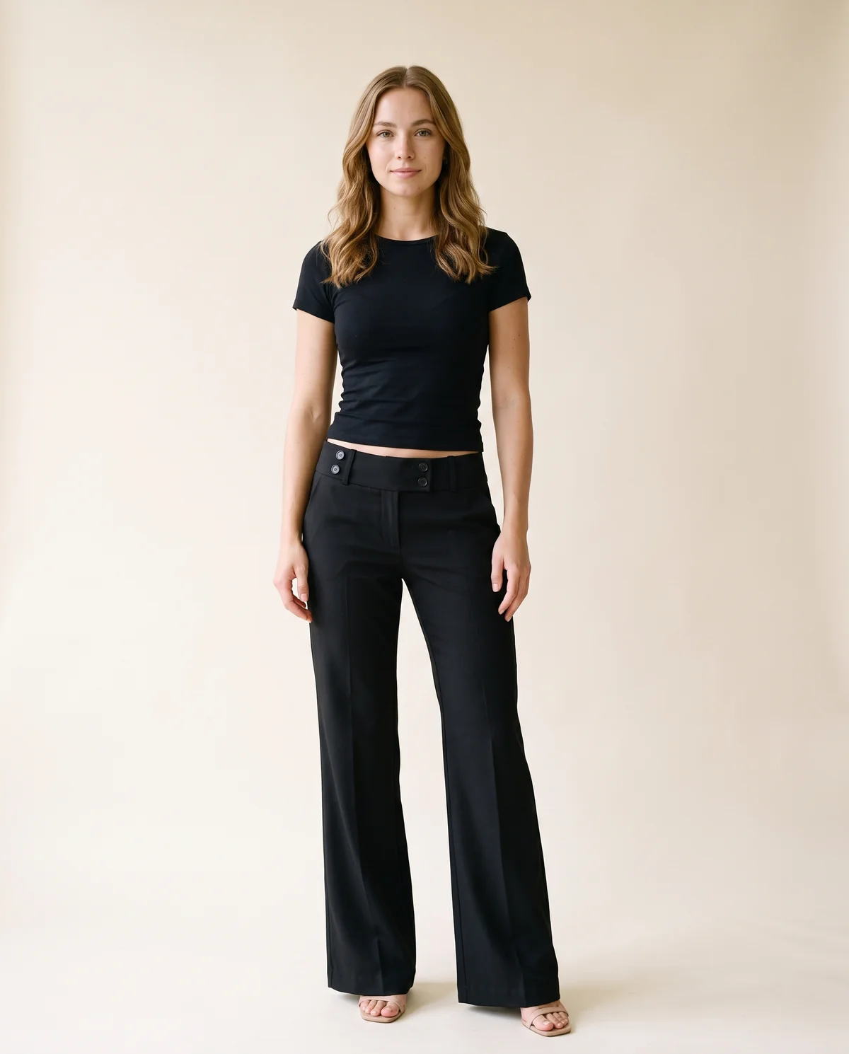 Low-Rise Tailored Wide-Leg Trousers in Black, front view, worn by Ava