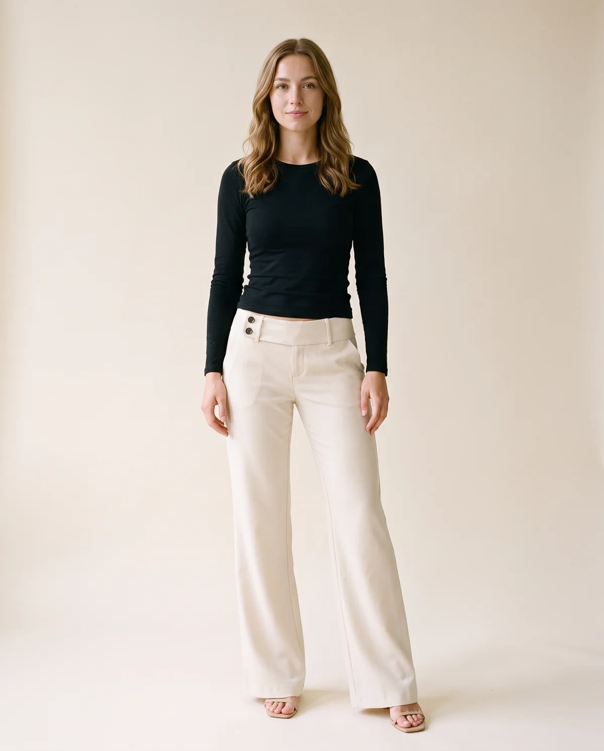 Low-Rise Tailored Wide-Leg Trousers in Cream, front view, worn by Ava