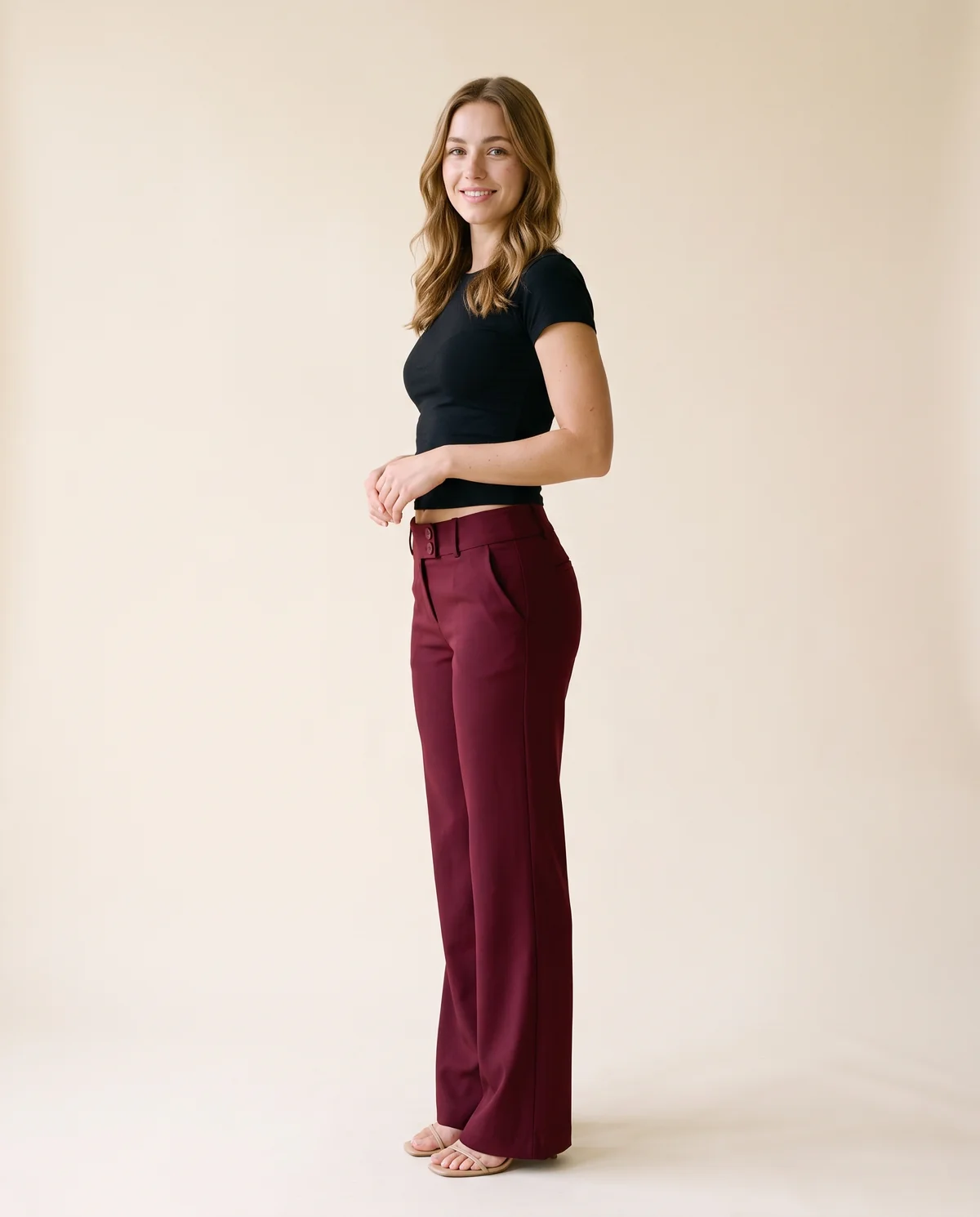 Low-Rise Tailored Wide-Leg Trousers in Burgundy, side view, worn by Ava