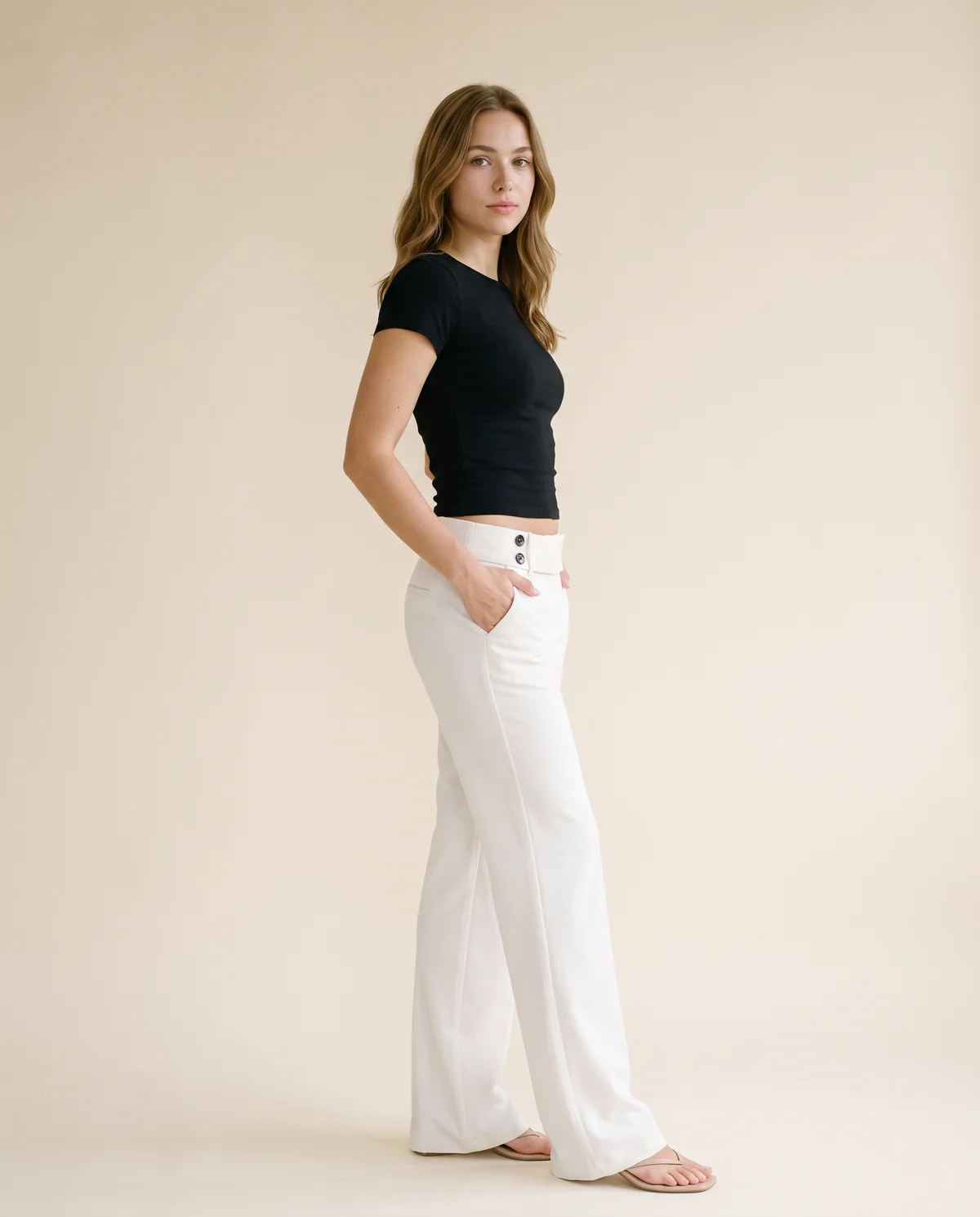 Low-Rise Tailored Wide-Leg Trousers in White, side view, worn by Ava